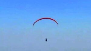 Read more about the article Roads choked, youth paraglides to exam hall